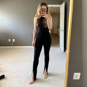 Adika black stretchy pants with split ends. Size small. Tags still on